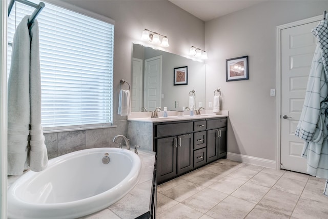 1225 Horsemint Dr, Little Elm, TX 75068 - full bath with double vanity, a bath, and baseboards