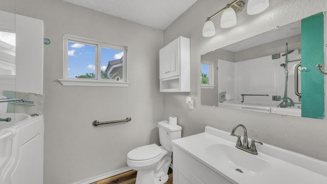 239 N 10th St, Jacksboro, TX 76458 - full bath featuring toilet, plenty of natural light, vanity, and a shower