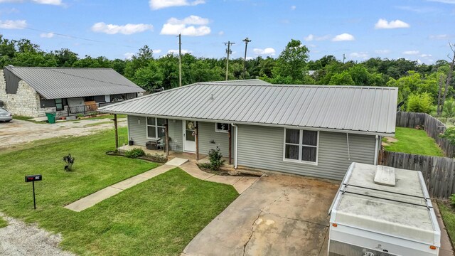 239 N 10th St, Jacksboro, TX 76458 - view of front of house featuring a porch and metal roof