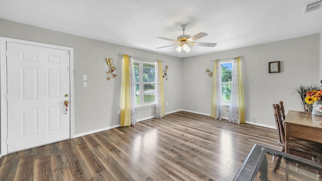 239 N 10th St, Jacksboro, TX 76458 - foyer with healthy amount of natural light, a ceiling fan, wood finished floors, and baseboards