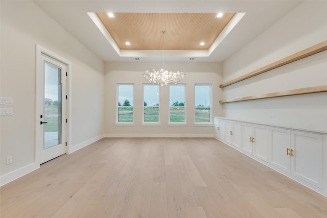 1700 Hamilton Ln, Northlake, TX 76247 - empty room featuring a tray ceiling, wood ceiling, a chandelier, light wood-style floors, and recessed lighting