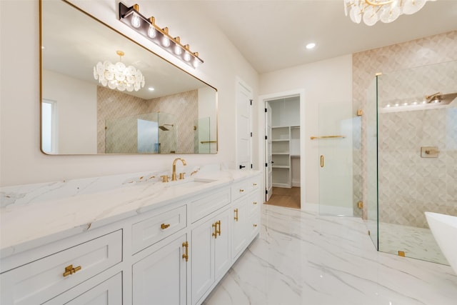 1700 Hamilton Ln, Northlake, TX 76247 - bathroom with a chandelier, a shower stall, vanity, marble tiled flooring, and a spacious closet