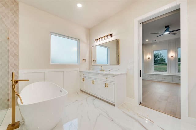 1700 Hamilton Ln, Northlake, TX 76247 - full bath with a soaking tub, vanity, marble finish floors, recessed lighting, and a decorative wall