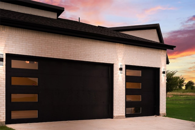 1700 Hamilton Ln, Northlake, TX 76247 - garage at dusk with concrete driveway