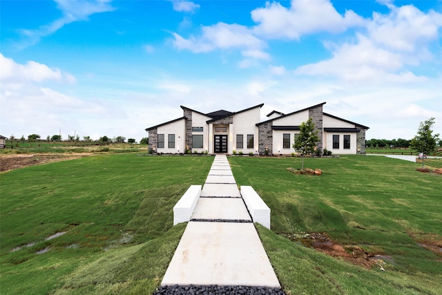 1700 Hamilton Ln, Northlake, TX 76247 - modern home featuring a front yard, stone siding, and french doors