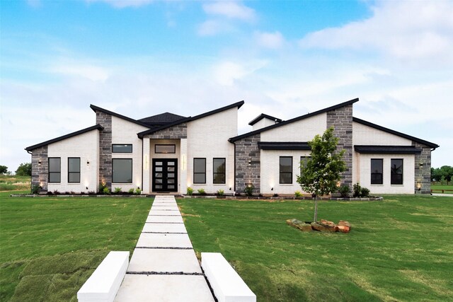 1700 Hamilton Ln, Northlake, TX 76247 - modern home with stone siding, a front lawn, and french doors
