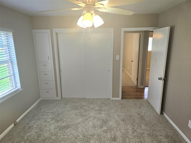 9474 Poinsetta Dr, Shreveport, LA 71118 - unfurnished bedroom featuring carpet, a closet, a ceiling fan, and baseboards