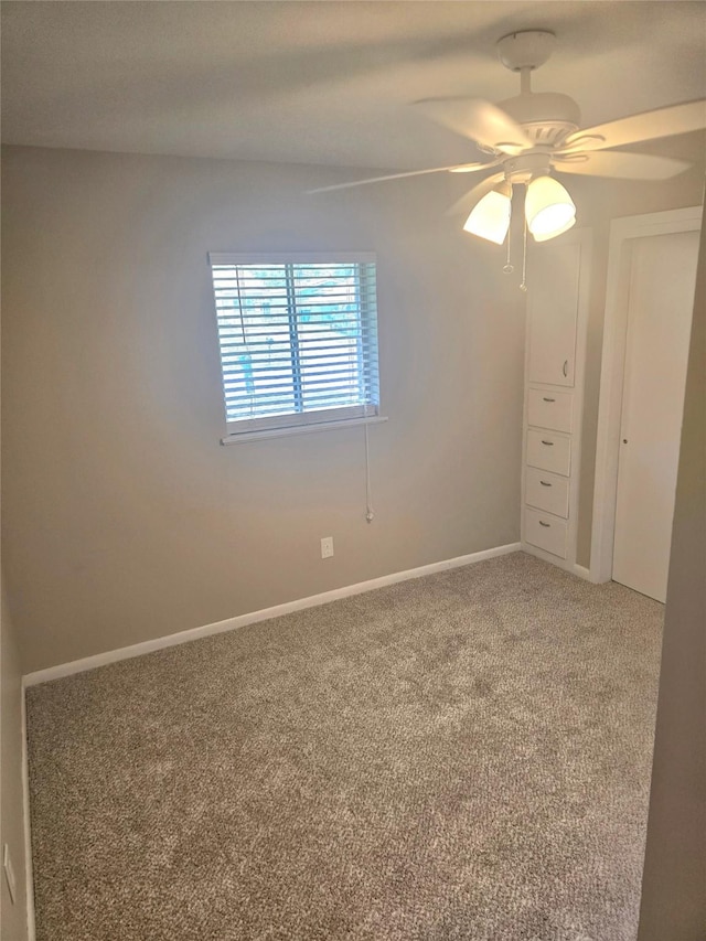 9474 Poinsetta Dr, Shreveport, LA 71118 - spare room featuring light colored carpet, a ceiling fan, and baseboards