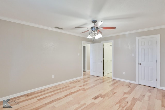 920 SW 3rd St, Hamlin, TX 79520 - unfurnished bedroom with ornamental molding, light wood finished floors, baseboards, ensuite bathroom, and a ceiling fan