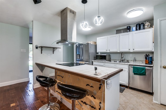 3232 Bunker Hill Dr, Forest Hill, TX 76140 - kitchen with stainless steel appliances, ventilation hood, white cabinets, and a sink