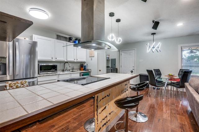 3232 Bunker Hill Dr, Forest Hill, TX 76140 - kitchen featuring tile countertops, appliances with stainless steel finishes, ventilation hood, a sink, and white cabinets