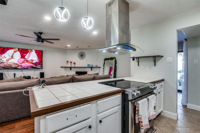 3232 Bunker Hill Dr, Forest Hill, TX 76140 - kitchen featuring open floor plan, electric range oven, a peninsula, island range hood, and recessed lighting