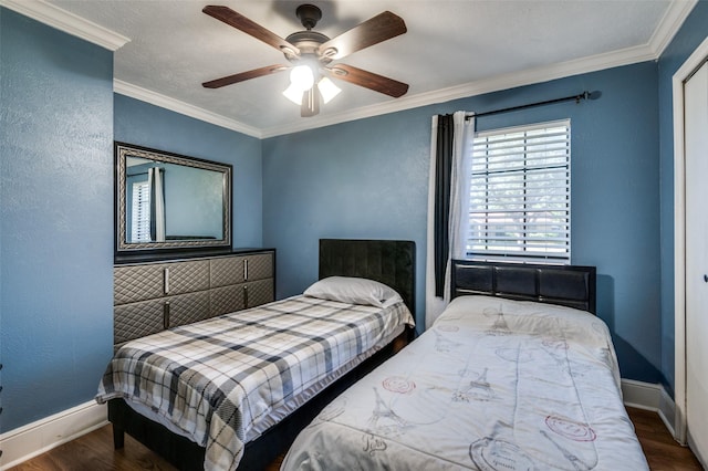 3232 Bunker Hill Dr, Forest Hill, TX 76140 - bedroom featuring wood finished floors, baseboards, ornamental molding, a textured wall, and ceiling fan