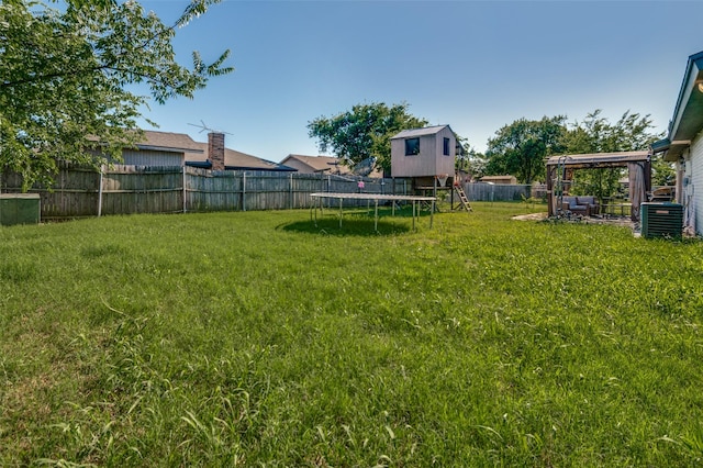 3232 Bunker Hill Dr, Forest Hill, TX 76140 - view of yard featuring a trampoline and central AC unit