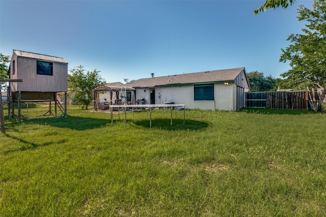 3232 Bunker Hill Dr, Forest Hill, TX 76140 - rear view of house featuring a trampoline, a gazebo, and brick siding