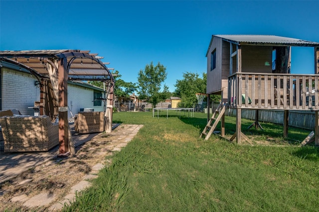 3232 Bunker Hill Dr, Forest Hill, TX 76140 - view of yard with a trampoline, a playground, and a wooden deck
