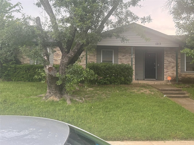 1213 Southridge Dr, Lancaster, TX 75146 - view of front of home with a front yard and brick siding