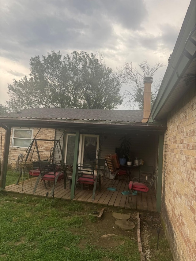 1213 Southridge Dr, Lancaster, TX 75146 - back of property featuring brick siding and a deck
