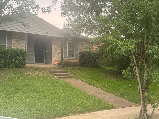 1213 Southridge Dr, Lancaster, TX 75146 - view of front of property with brick siding and a front lawn
