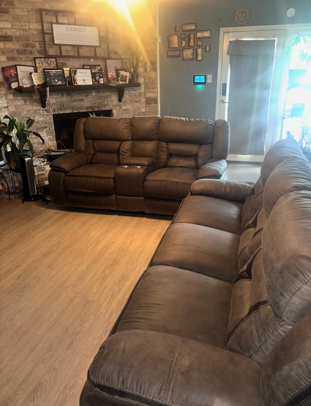 1213 Southridge Dr, Lancaster, TX 75146 - living area featuring wood finished floors and a fireplace