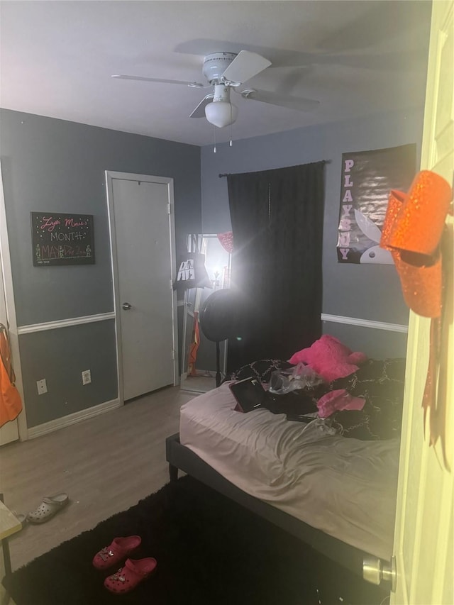 1213 Southridge Dr, Lancaster, TX 75146 - bedroom featuring wood finished floors, baseboards, and ceiling fan