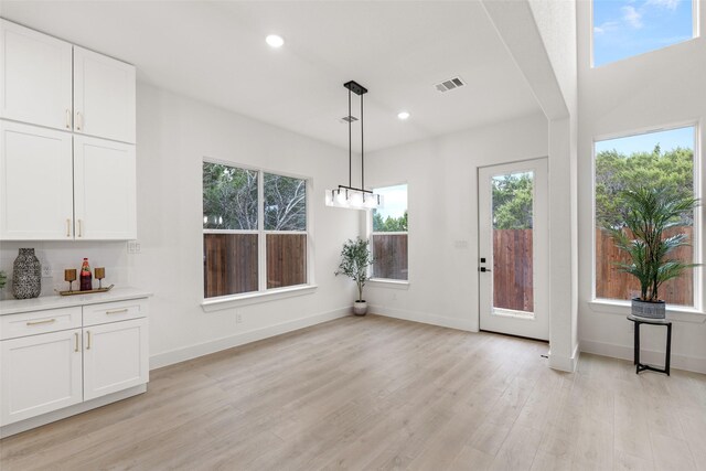 5634 Barkridge Dr, Granbury, TX 76048 - unfurnished dining area with light wood-style floors, recessed lighting, and baseboards