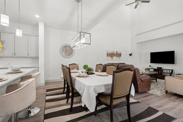 12947 Cabana Dr, Frisco, TX 75035 - dining room featuring light wood-style flooring, high vaulted ceiling, a chandelier, a ceiling fan, and recessed lighting