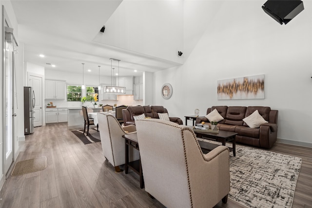 12947 Cabana Dr, Frisco, TX 75035 - living room featuring light wood-type flooring and recessed lighting