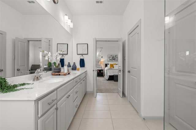 12947 Cabana Dr, Frisco, TX 75035 - ensuite bathroom featuring vanity, tile patterned flooring, and baseboards