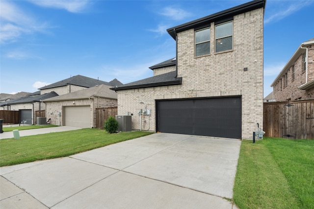12947 Cabana Dr, Frisco, TX 75035 - view of front of house featuring brick siding, a garage, central air condition unit, and concrete driveway