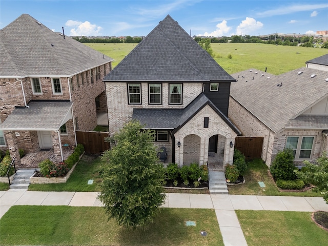 12947 Cabana Dr, Frisco, TX 75035 - french country style house with brick siding and a shingled roof