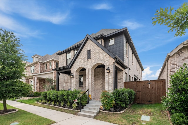 12947 Cabana Dr, Frisco, TX 75035 - view of front of house featuring brick siding and a gate