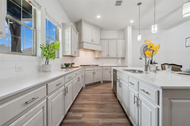 12947 Cabana Dr, Frisco, TX 75035 - kitchen featuring a sink, white cabinets, light countertops, recessed lighting, and decorative backsplash