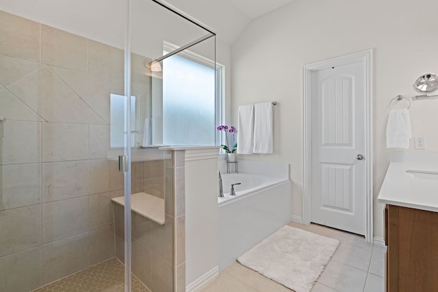 1052 Winecup Ln, Weatherford, TX 76085 - full bath featuring vanity, a shower stall, a garden tub, tile patterned floors, and lofted ceiling