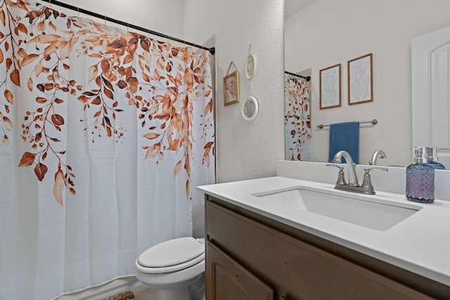 1052 Winecup Ln, Weatherford, TX 76085 - full bathroom with vanity, toilet, a textured wall, and a shower with curtain