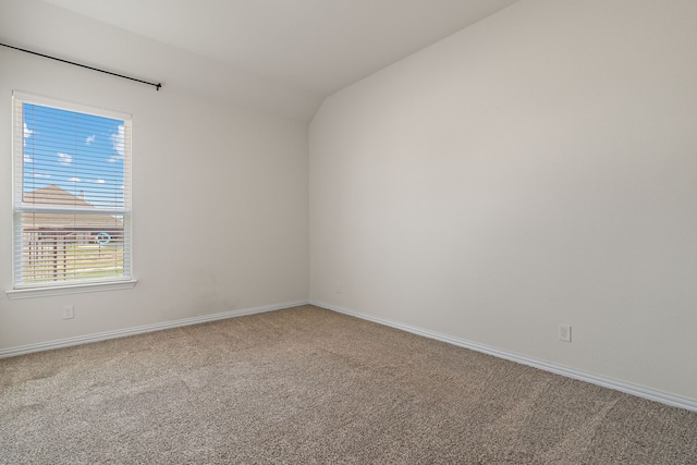 1052 Winecup Ln, Weatherford, TX 76085 - spare room with carpet, vaulted ceiling, and baseboards