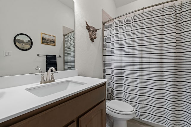1052 Winecup Ln, Weatherford, TX 76085 - full bathroom featuring toilet, vanity, a textured wall, and curtained shower