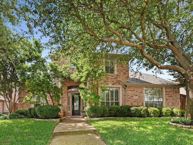 1025 Arches Park Dr, Allen, TX 75013 - view of front of house with brick siding, a front yard, and roof with shingles