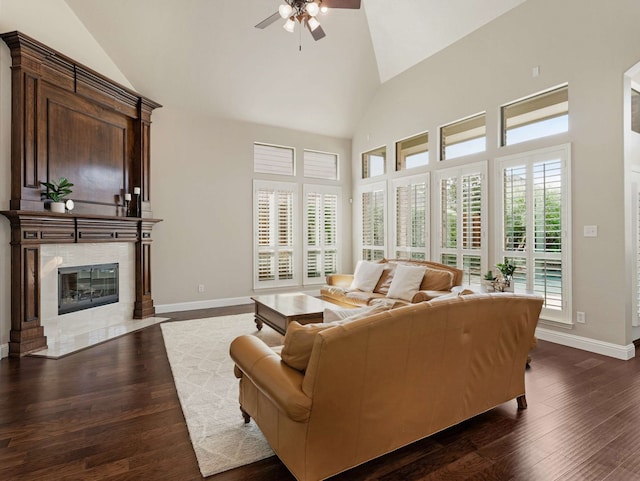 1025 Arches Park Dr, Allen, TX 75013 - living area with ceiling fan, baseboards, wood finished floors, high vaulted ceiling, and a tile fireplace