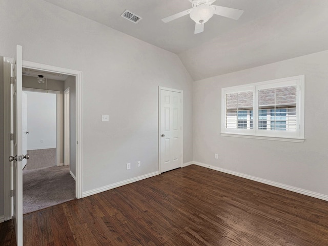 1025 Arches Park Dr, Allen, TX 75013 - unfurnished bedroom featuring dark wood finished floors, baseboards, vaulted ceiling, and a ceiling fan