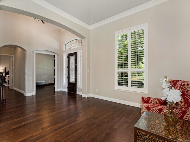 1025 Arches Park Dr, Allen, TX 75013 - entrance foyer with arched walkways, dark wood-style floors, ornamental molding, and baseboards