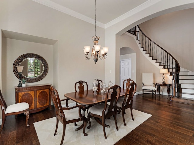 1025 Arches Park Dr, Allen, TX 75013 - dining space with arched walkways, stairway, hardwood / wood-style floors, crown molding, and baseboards