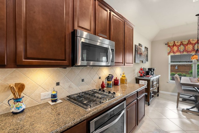 1129 Mesa Crest Dr, Fort Worth, TX 76052 - kitchen featuring stainless steel appliances, tasteful backsplash, baseboards, vaulted ceiling, and light stone counters