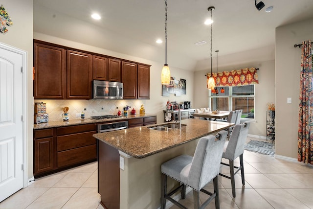 1129 Mesa Crest Dr, Fort Worth, TX 76052 - kitchen featuring a sink, appliances with stainless steel finishes, light tile patterned floors, decorative backsplash, and recessed lighting