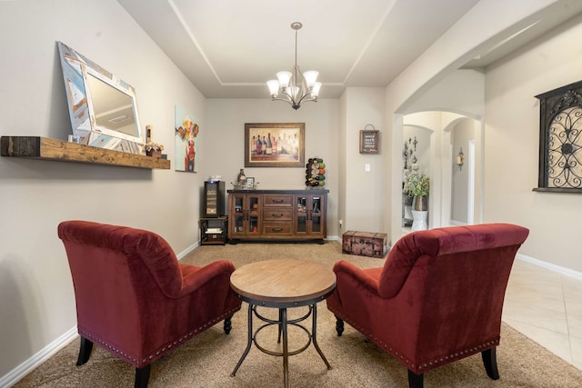 1129 Mesa Crest Dr, Fort Worth, TX 76052 - sitting room featuring arched walkways, a chandelier, baseboards, and carpet