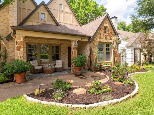 6319 Mccommas Blvd, Dallas, TX 75214 - back of house featuring roof with shingles, brick siding, a patio, a chimney, and outdoor lounge area