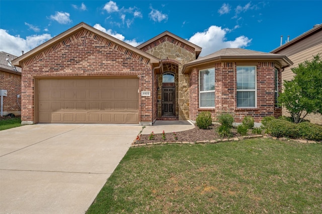 5825 Loveland Dr, Denton, TX 76208 - view of front of home featuring brick siding, concrete driveway, a garage, and a front lawn