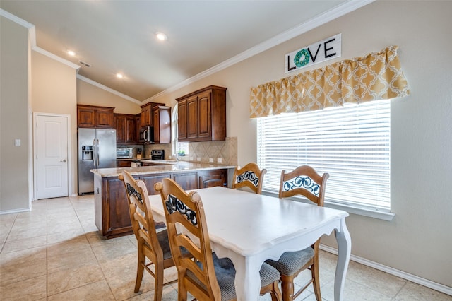 5825 Loveland Dr, Denton, TX 76208 - dining area with baseboards, crown molding, light tile patterned floors, vaulted ceiling, and recessed lighting