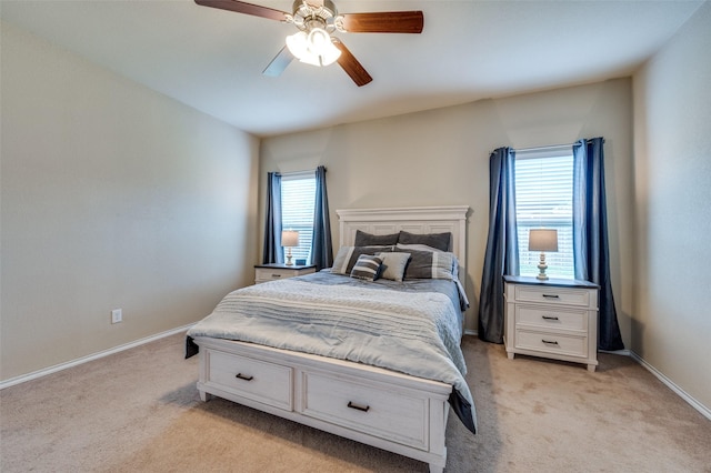 5825 Loveland Dr, Denton, TX 76208 - bedroom with light colored carpet, multiple windows, and baseboards