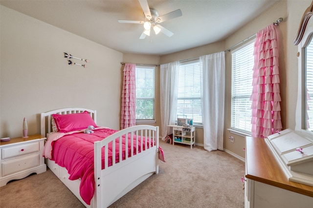 5825 Loveland Dr, Denton, TX 76208 - bedroom with multiple windows, light carpet, and ceiling fan